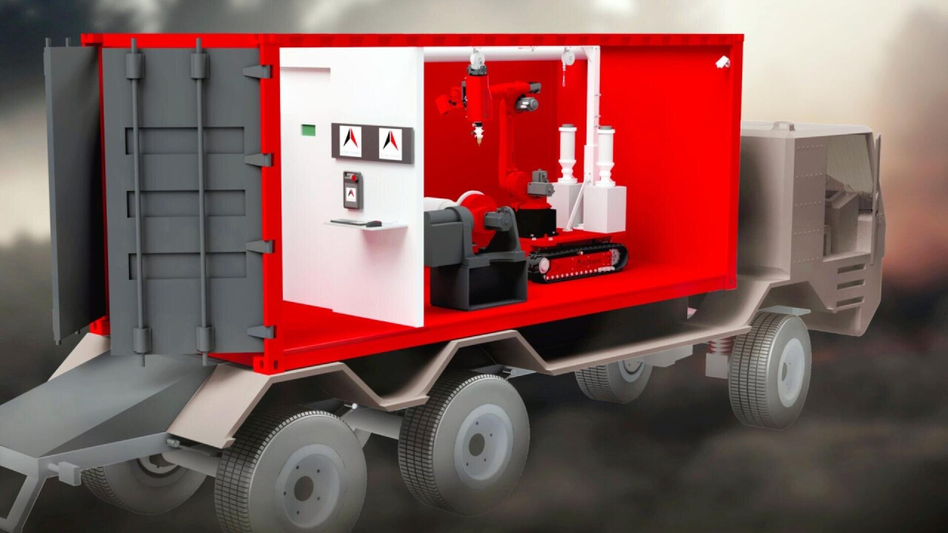 A cutaway illustration of a large truck shows a bright red container on its bed, containing a robotic vehicle, control panels, and equipment, highlighting a mobile robotic operating station for hazardous environments.