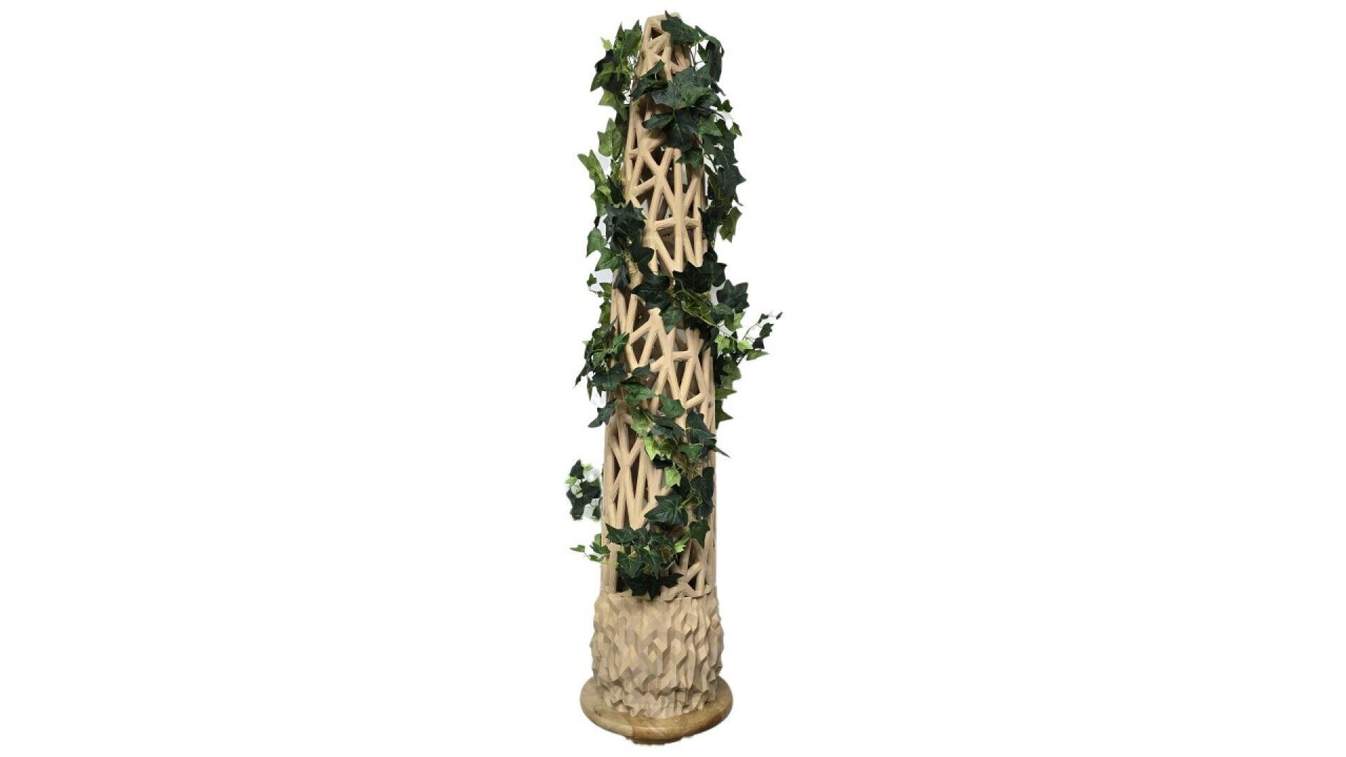 A tall, beige, cylindrical sculpture with an intricate lattice design, wrapped in artificial green ivy leaves, standing on a round base against a white background.