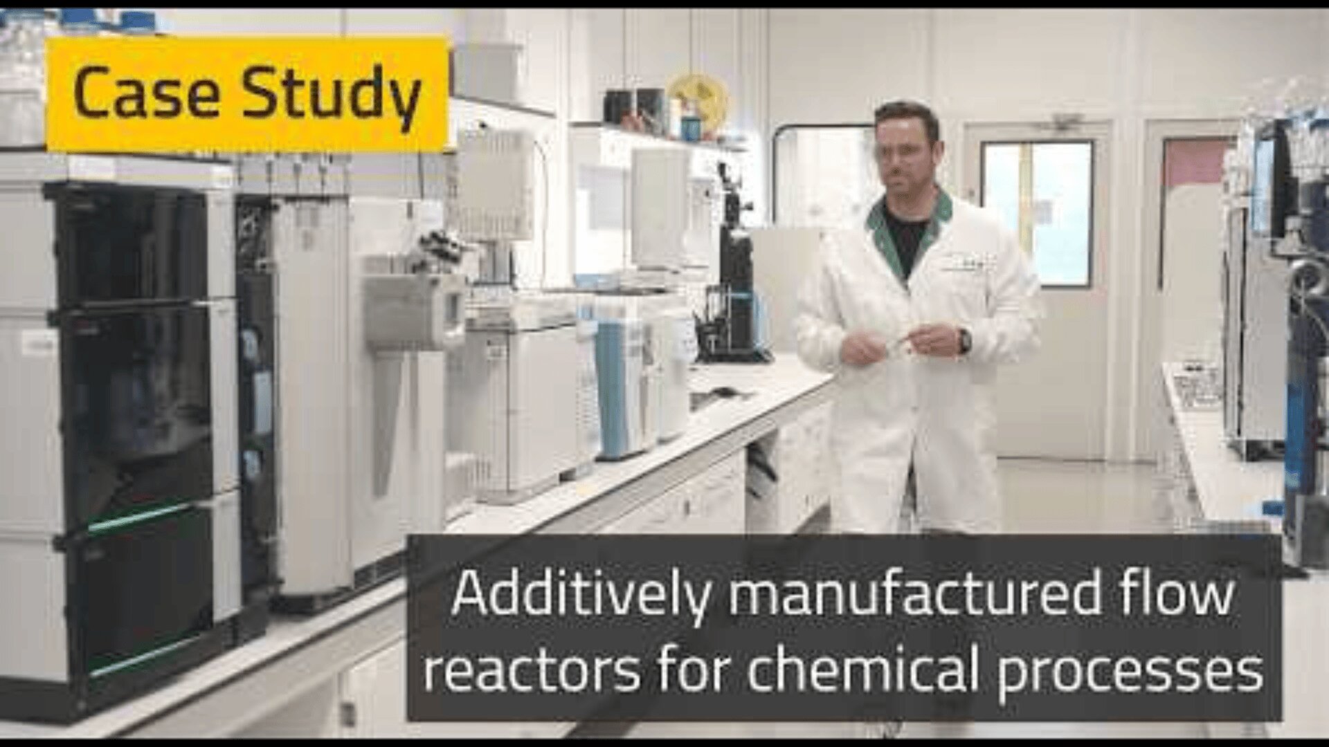 A scientist in a white lab coat stands in a laboratory with scientific equipment. Text reads Case Study and Additively manufactured flow reactors for chemical processes.