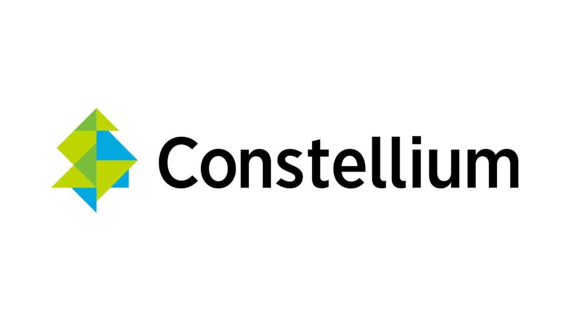 Constellium logo featuring a geometric, multicolored abstract shape on the left, combining green, blue, and yellow triangles, with the word Constellium in black modern font on a white background.